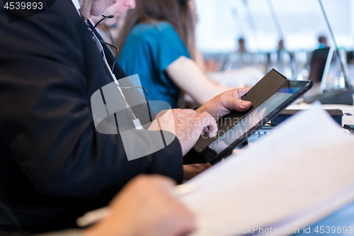 Image of close up of business people hands using tablet computer