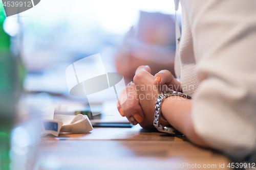 Image of close up of business people taking notes