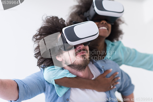 Image of multiethnic couple getting experience using VR headset glasses