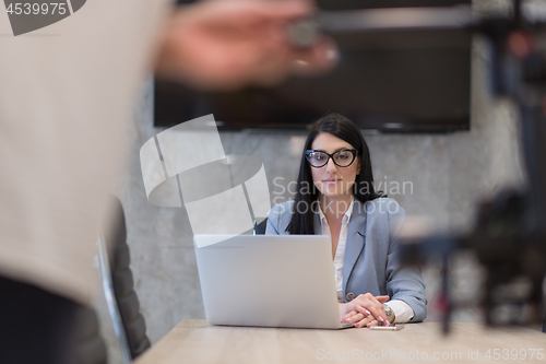 Image of businesswoman using a laptop in startup office