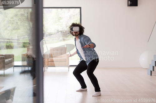 Image of man using VR-headset glasses of virtual reality