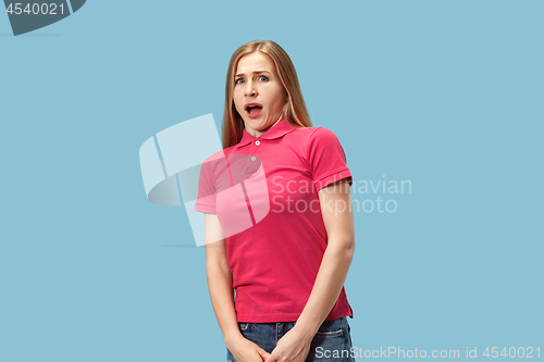 Image of Portrait of the scared woman on blue