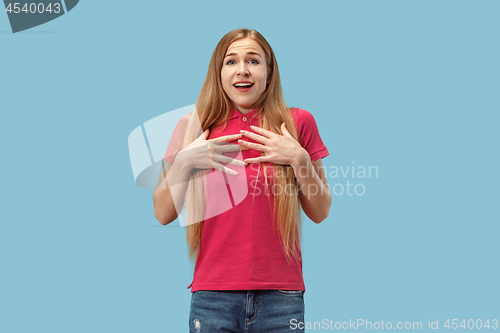 Image of Beautiful woman looking suprised isolated on blue