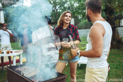 Image of Group of friends making barbecue in the backyard. concept about good and positive mood with friends