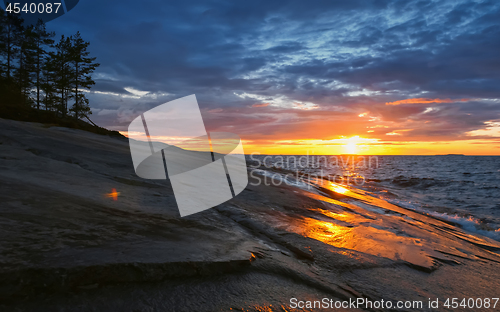 Image of Golden Sunset in Stormy Sky over Lake Onega