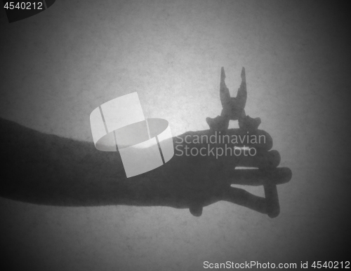 Image of Silhouette behind a transparent paper