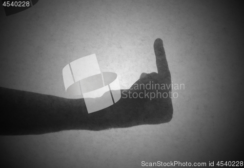 Image of Silhouette behind a transparent paper