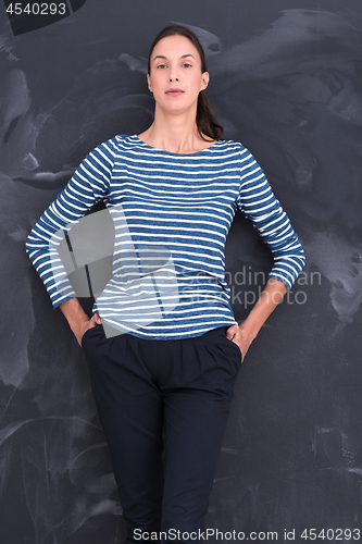 Image of woman standing in front of chalk drawing board