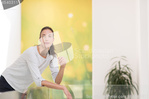 Image of portrait of a young beautiful woman at home