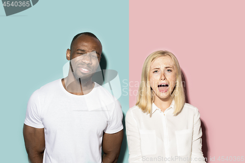 Image of Man and woman posing at studio during quarrel