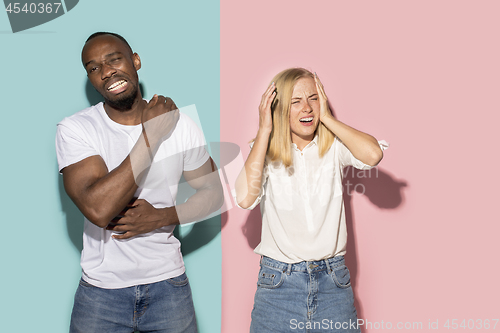 Image of Young couple with a pain in the shoulder