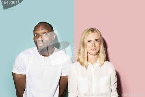 Image of Man and woman posing at studio during quarrel