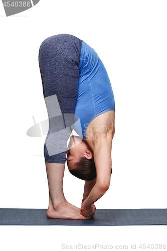 Image of Woman doing Ashtanga Vinyasa yoga asana Padangusthasana - foot t