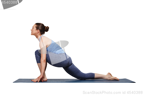 Image of Woman doing Hatha yoga asana Anjaneyasana