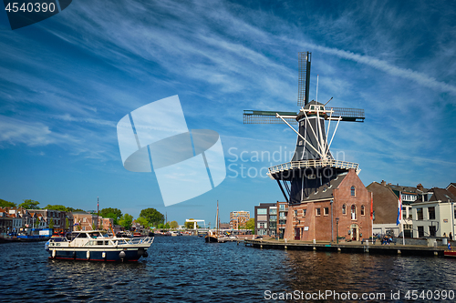 Image of Harlem landmark windmill De Adriaan on Spaarne river. Harlem,