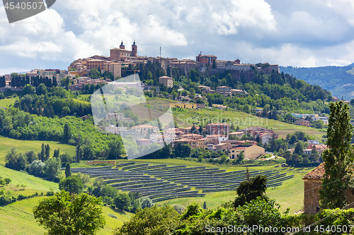 Image of Camerino in Italy Marche over colourful fields