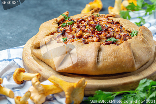 Image of Traditional pie (Galette) with wild chanterelles.