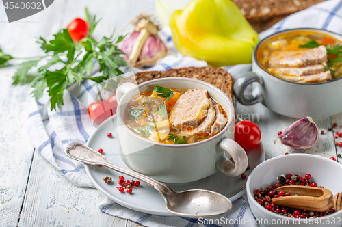 Image of Soup of fresh cabbage, meat and fresh herbs.