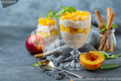 Image of Rice pudding with nectarine. Delicious breakfast.