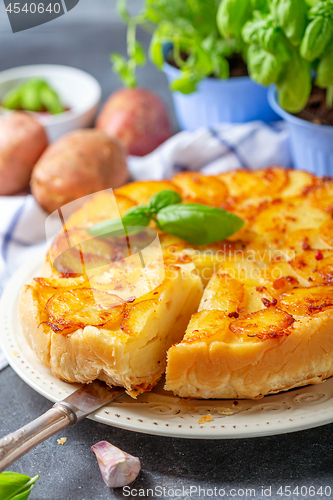 Image of Sliced traditional potato pie.