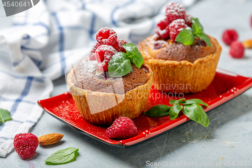 Image of Mini tarts with raspberry fruit and almond cream.