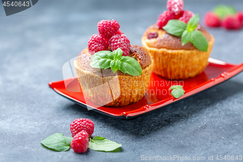 Image of Raspberry tartlets with almond cream and mint.