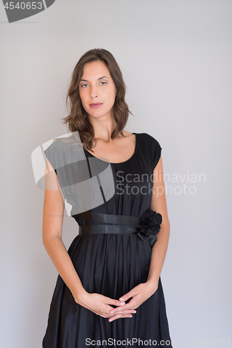 Image of woman in a black dress isolated on white background