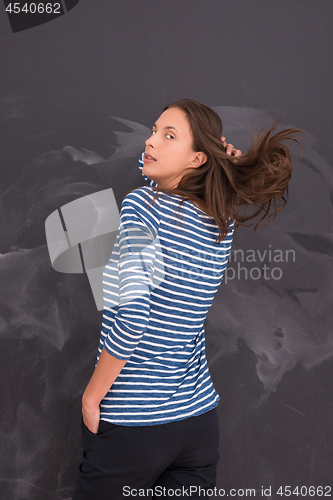 Image of woman standing in front of chalk drawing board