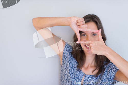 Image of woman showing framing hand gesture