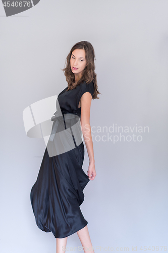 Image of woman in a black dress isolated on white background
