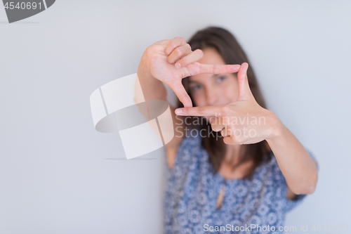 Image of woman showing framing hand gesture