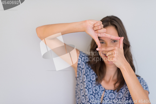 Image of woman showing framing hand gesture