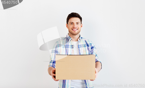 Image of happy man holding cardboard box