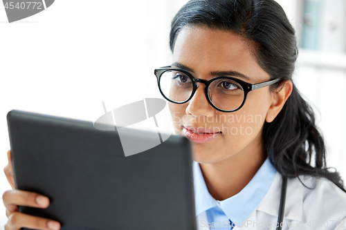 Image of close up of female doctor with tablet computer