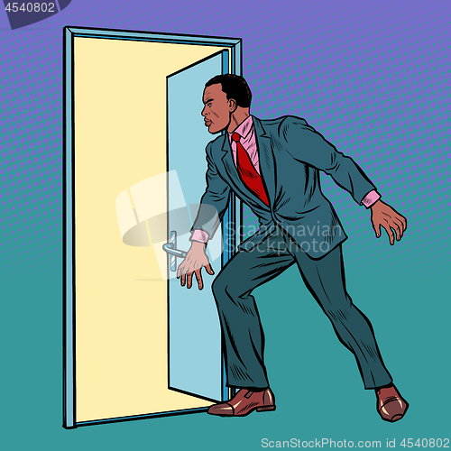 Image of African man opens the door