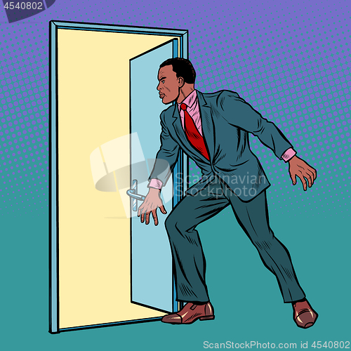 Image of African man opens the door