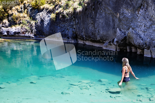 Image of Woman enjoying the cool blue waters of the limestone caves