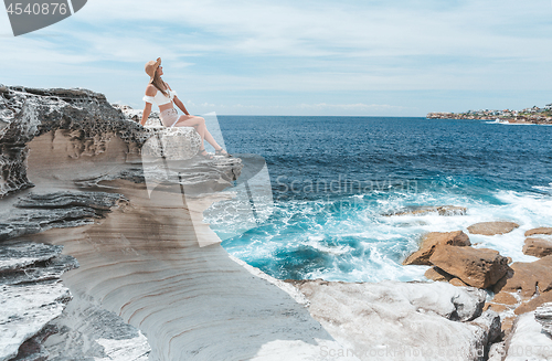 Image of Female enjoying the summer sun by the coast in Australia