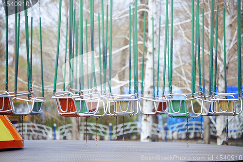 Image of Empty chain swing in amuzement park