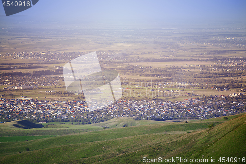 Image of High angle view onto the green fields and villages