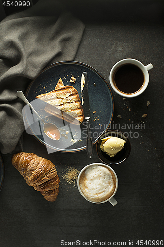 Image of Breakfast with coffee and croissant