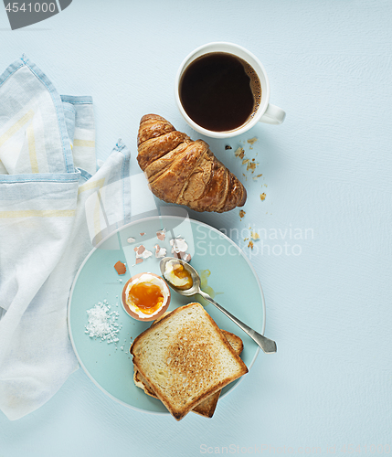 Image of Breakfast with coffee and croissant