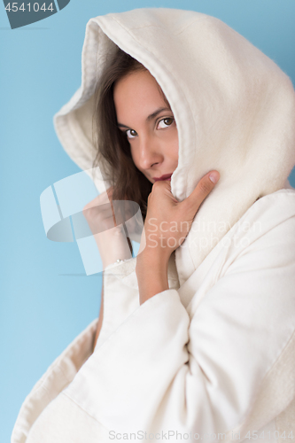 Image of woman in a white coat with hood isolated on blue background