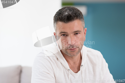 Image of Portrait of a young man at home