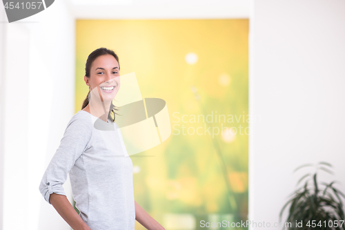 Image of portrait of a young beautiful woman at home