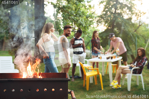 Image of Group of friends making barbecue in the backyard. concept about good and positive mood with friends