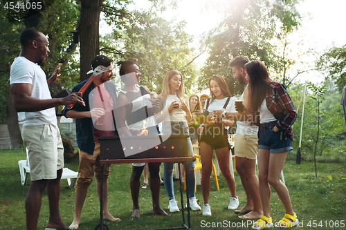 Image of Group of friends making barbecue in the backyard. concept about good and positive mood with friends