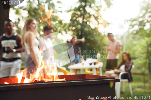 Image of Group of friends making barbecue in the backyard. concept about good and positive mood with friends