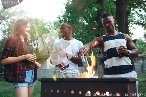 Image of Group of friends making barbecue in the backyard. concept about good and positive mood with friends