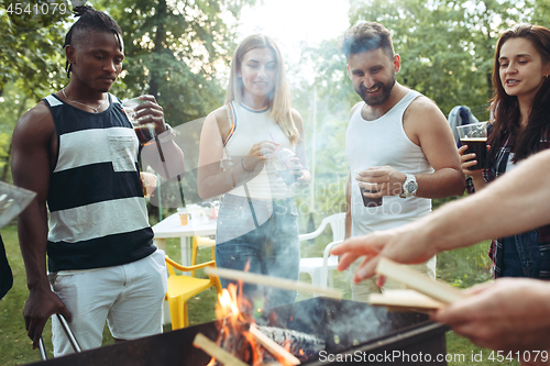 Image of Group of friends making barbecue in the backyard. concept about good and positive mood with friends